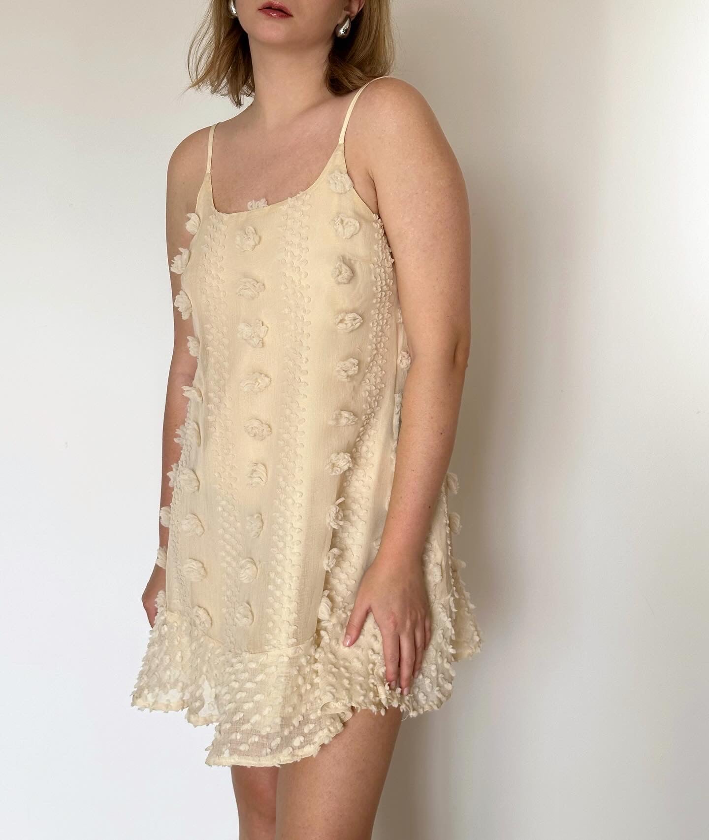 Lovely ivory mini dress with voluminous flowers decoration