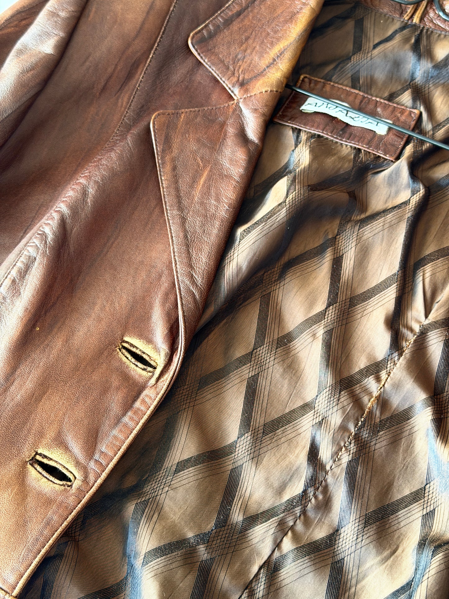 Vintage distressed leather jacket in rich brown tone