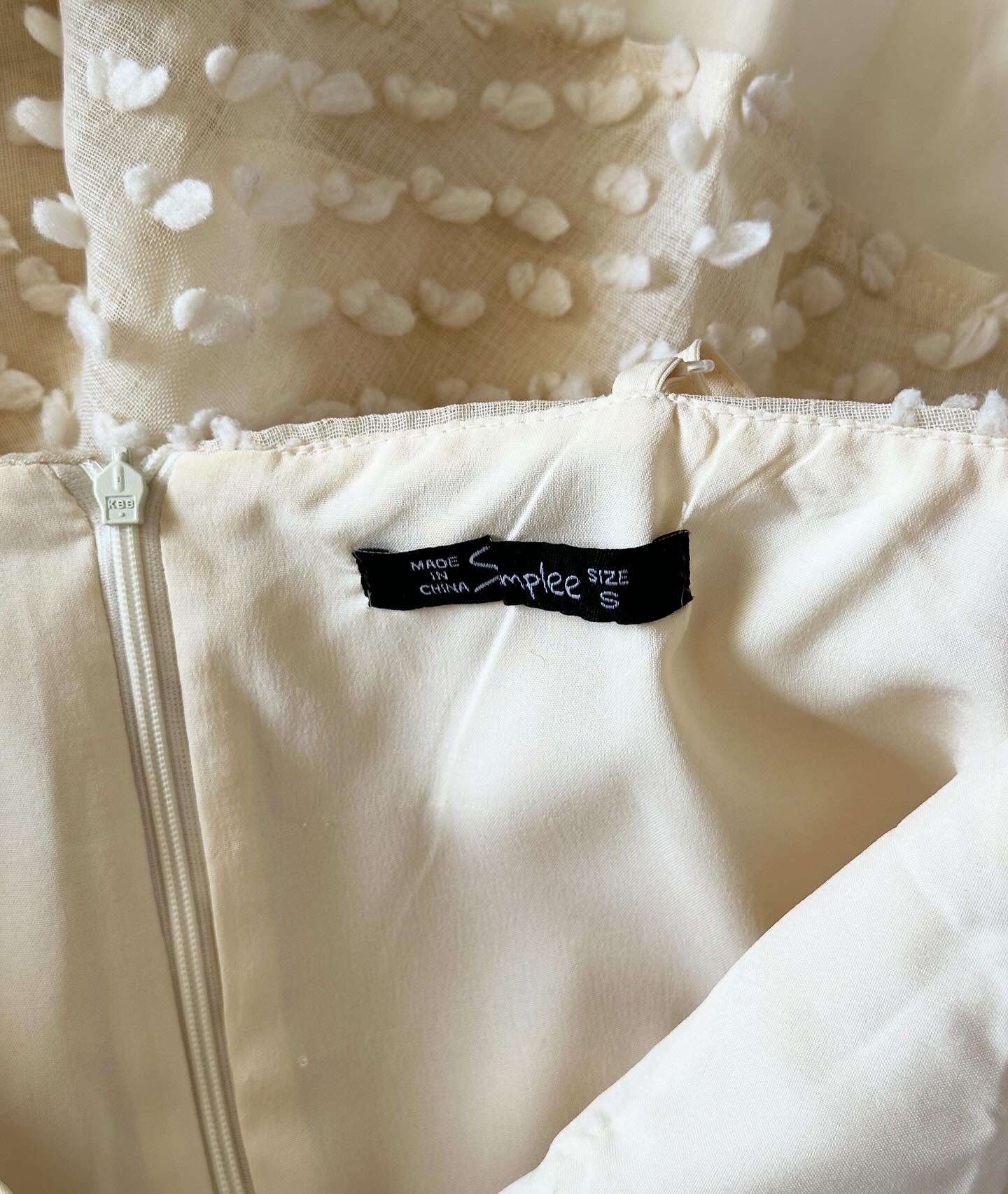 Lovely ivory mini dress with voluminous flowers decoration