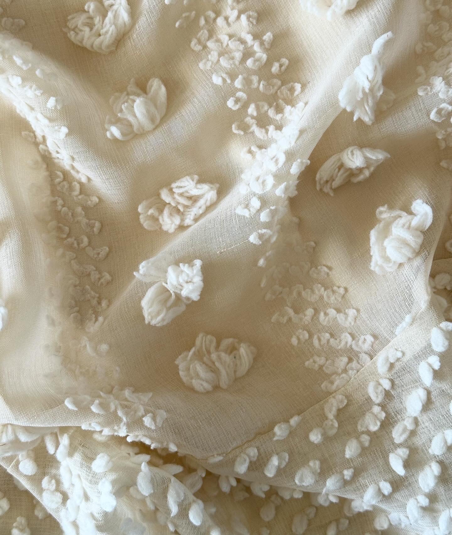 Lovely ivory mini dress with voluminous flowers decoration