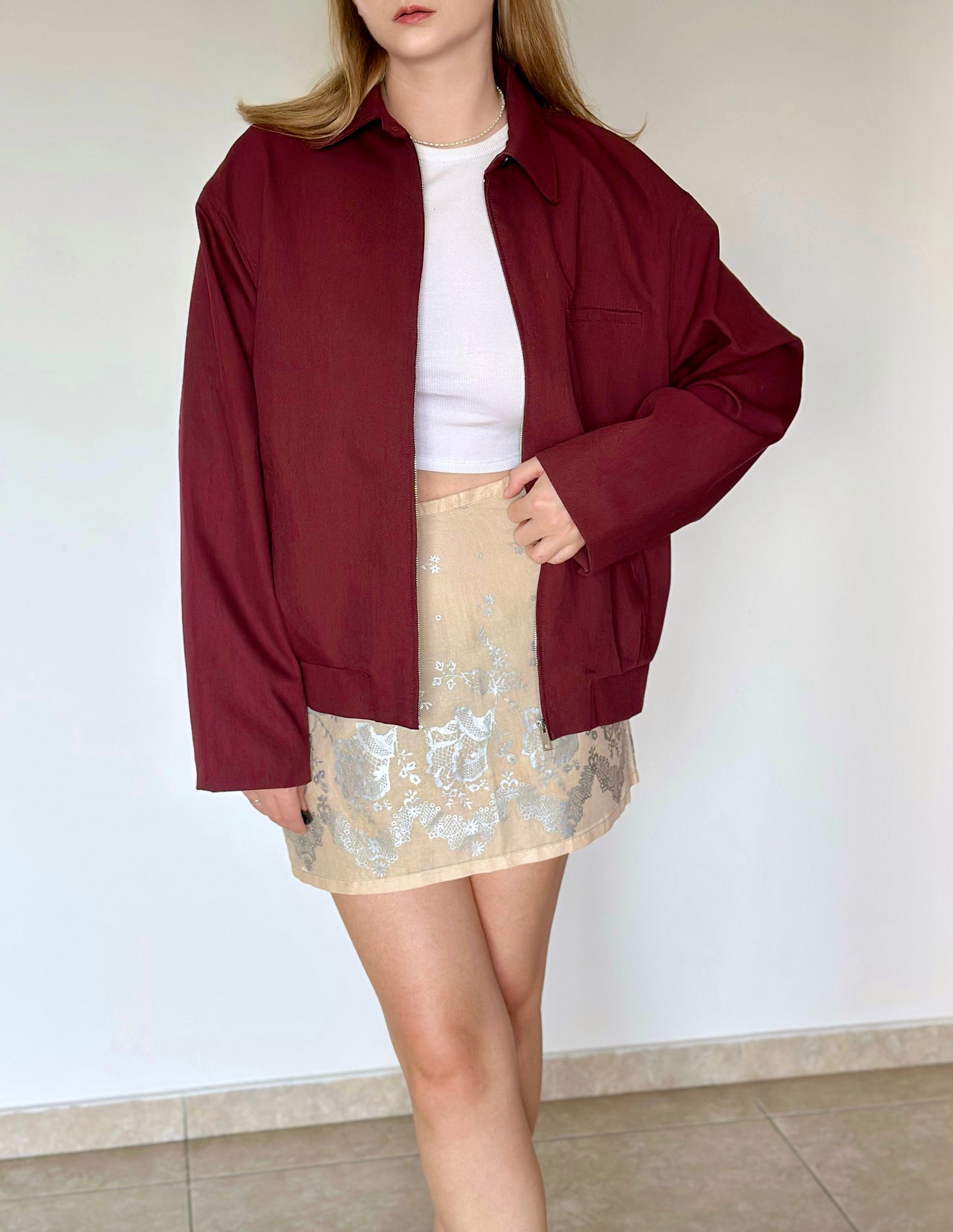 Soft beige cotton mini skirt with floral pattern