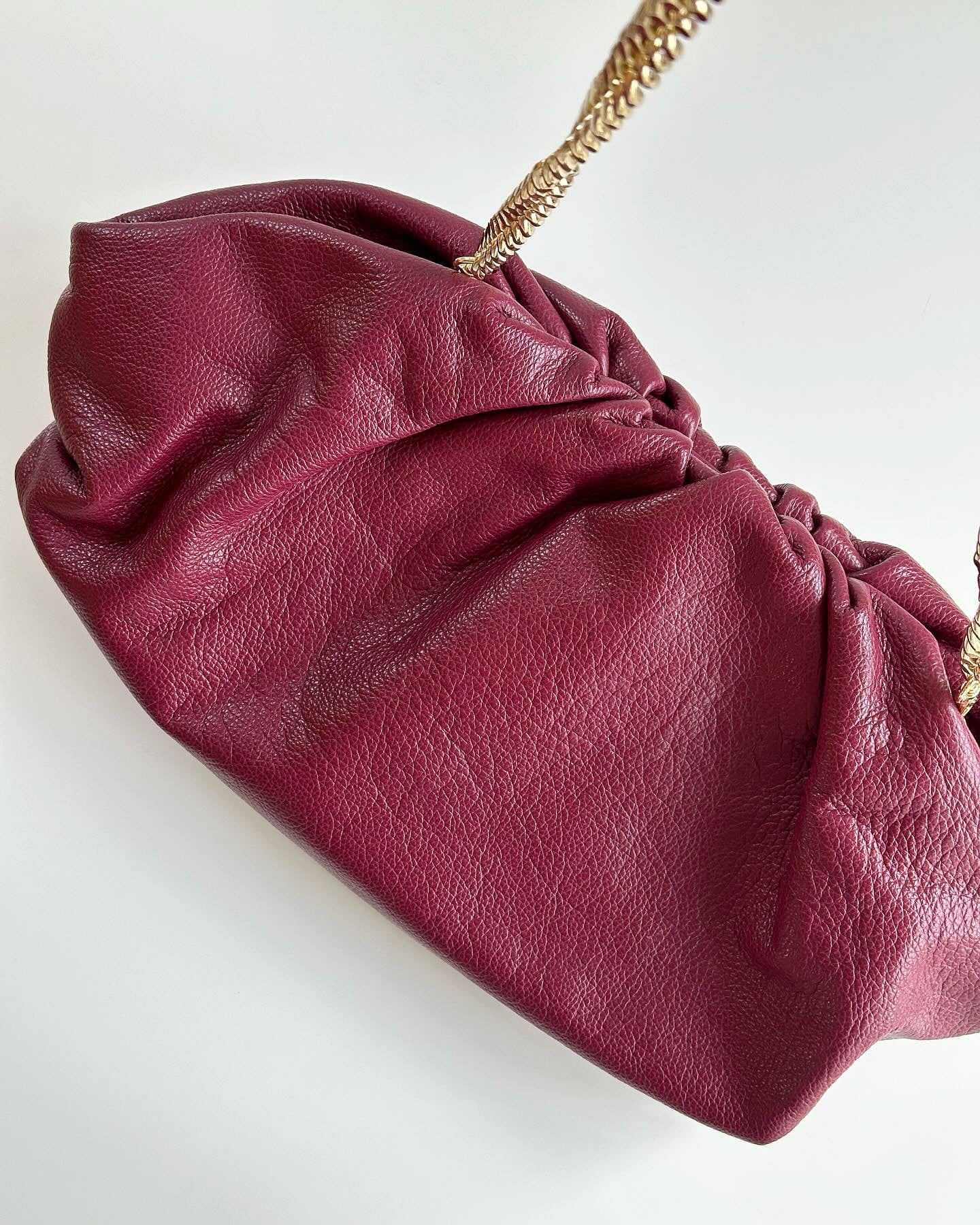 Amazing leather clutch bag in a burgundy color
