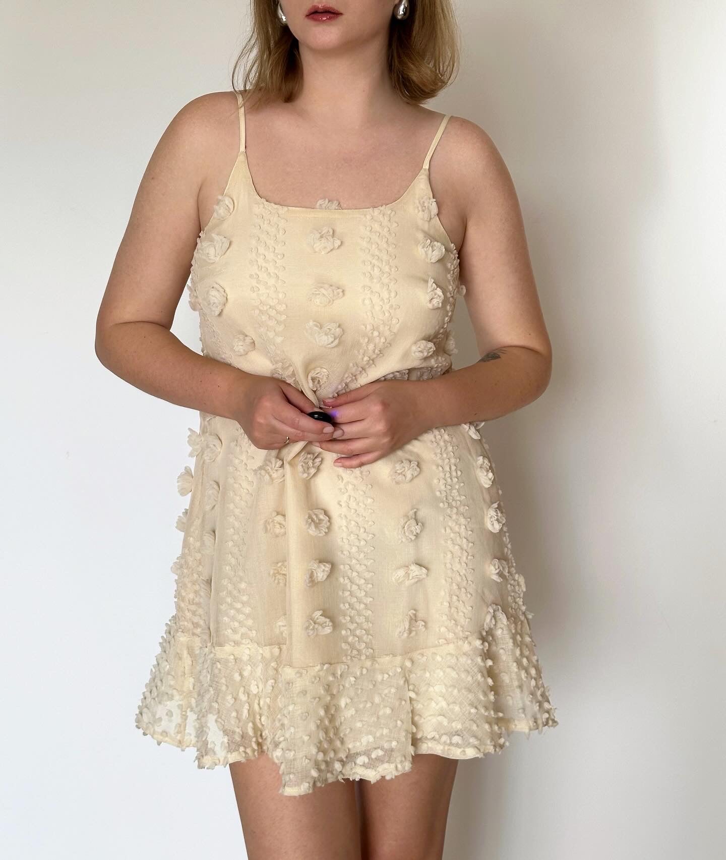 Lovely ivory mini dress with voluminous flowers decoration