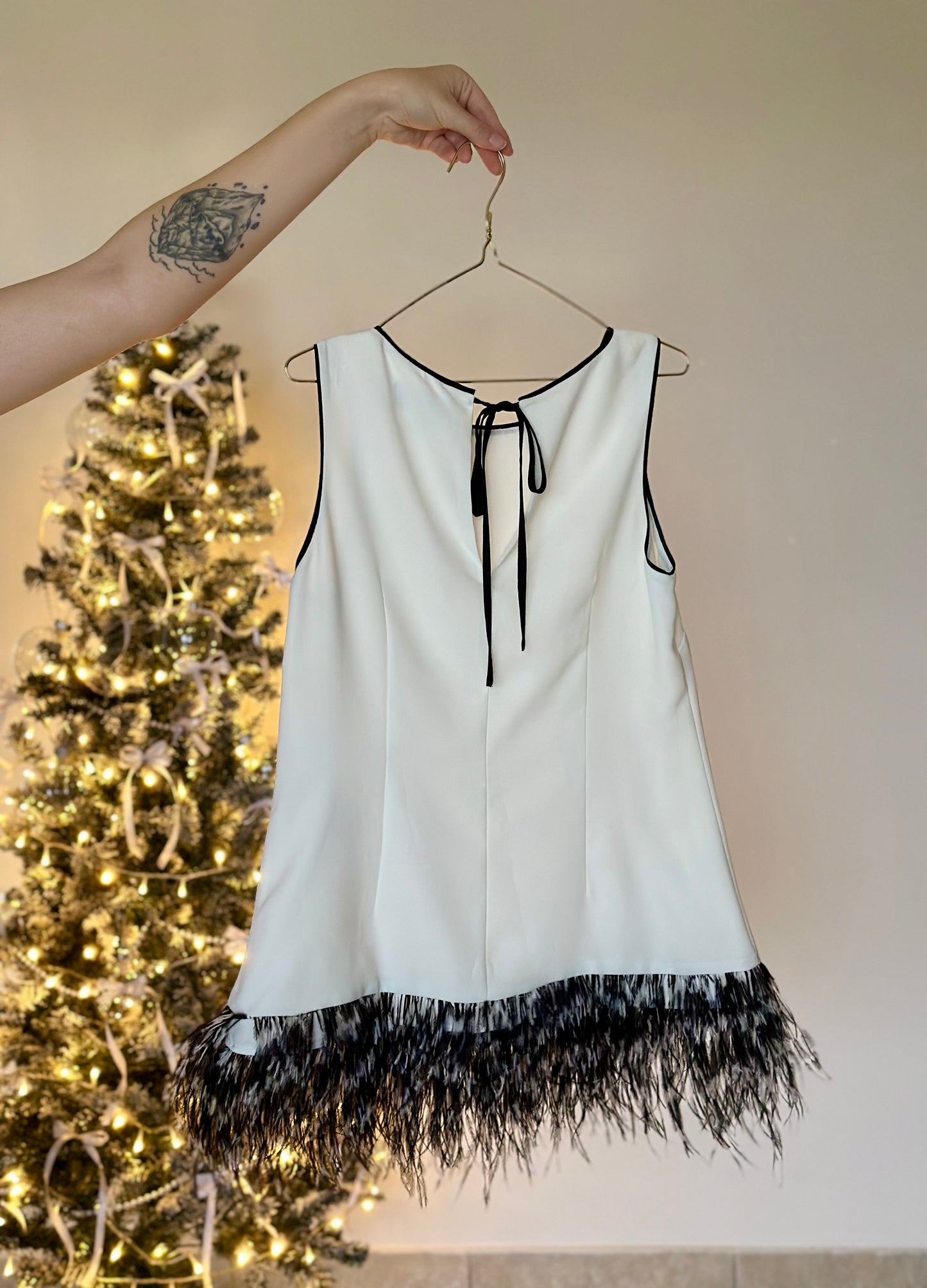 Lovely white tunic top with natural feathers