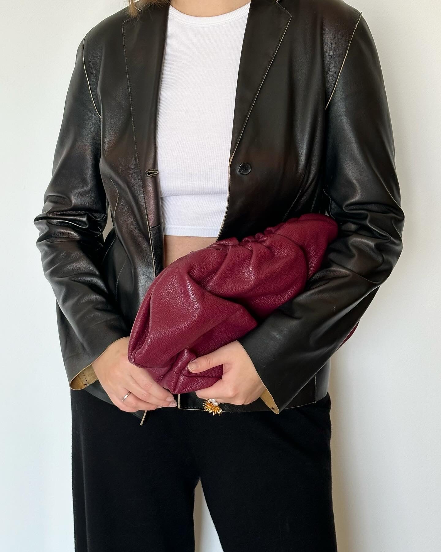 Amazing leather clutch bag in a burgundy color