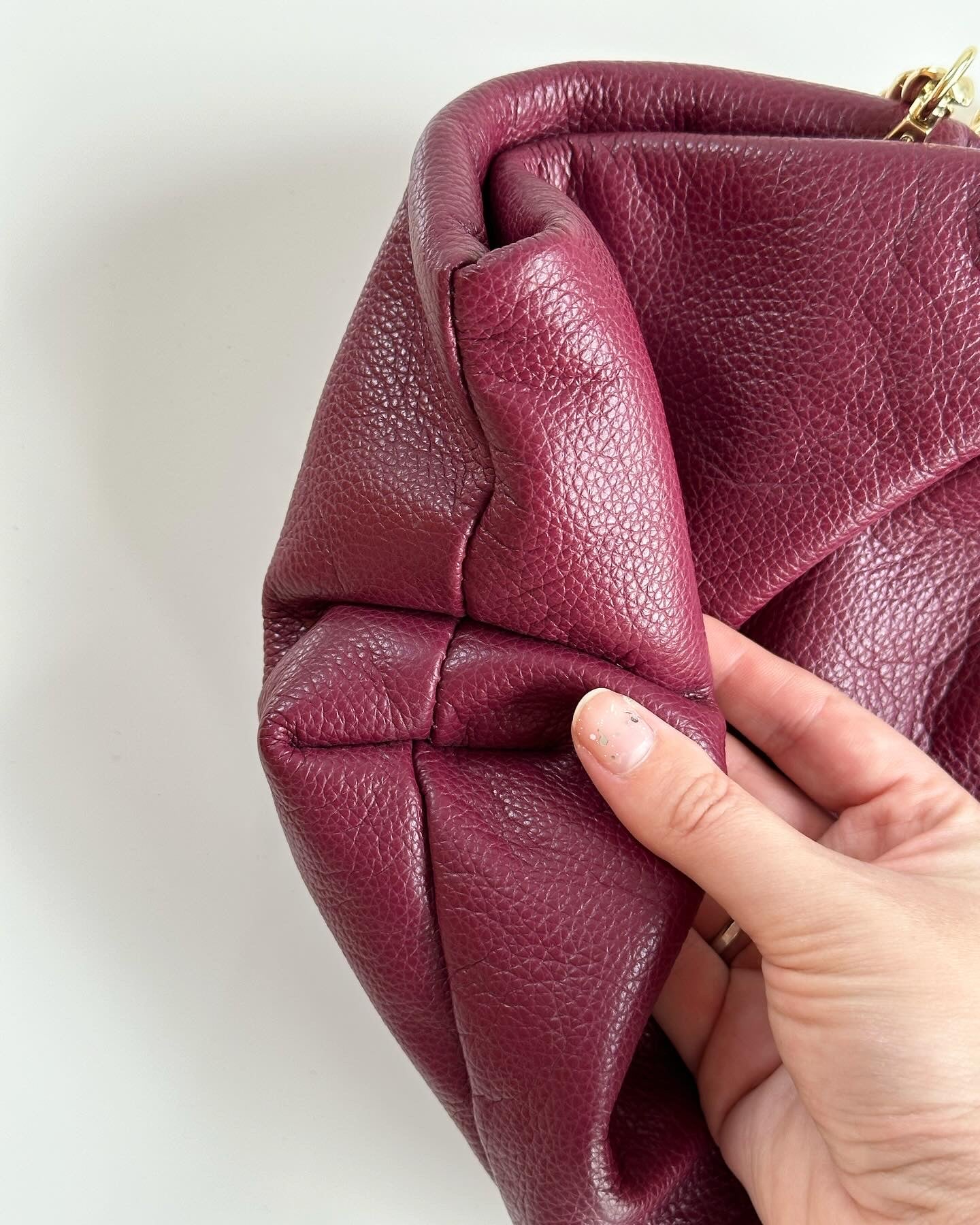 Amazing leather clutch bag in a burgundy color