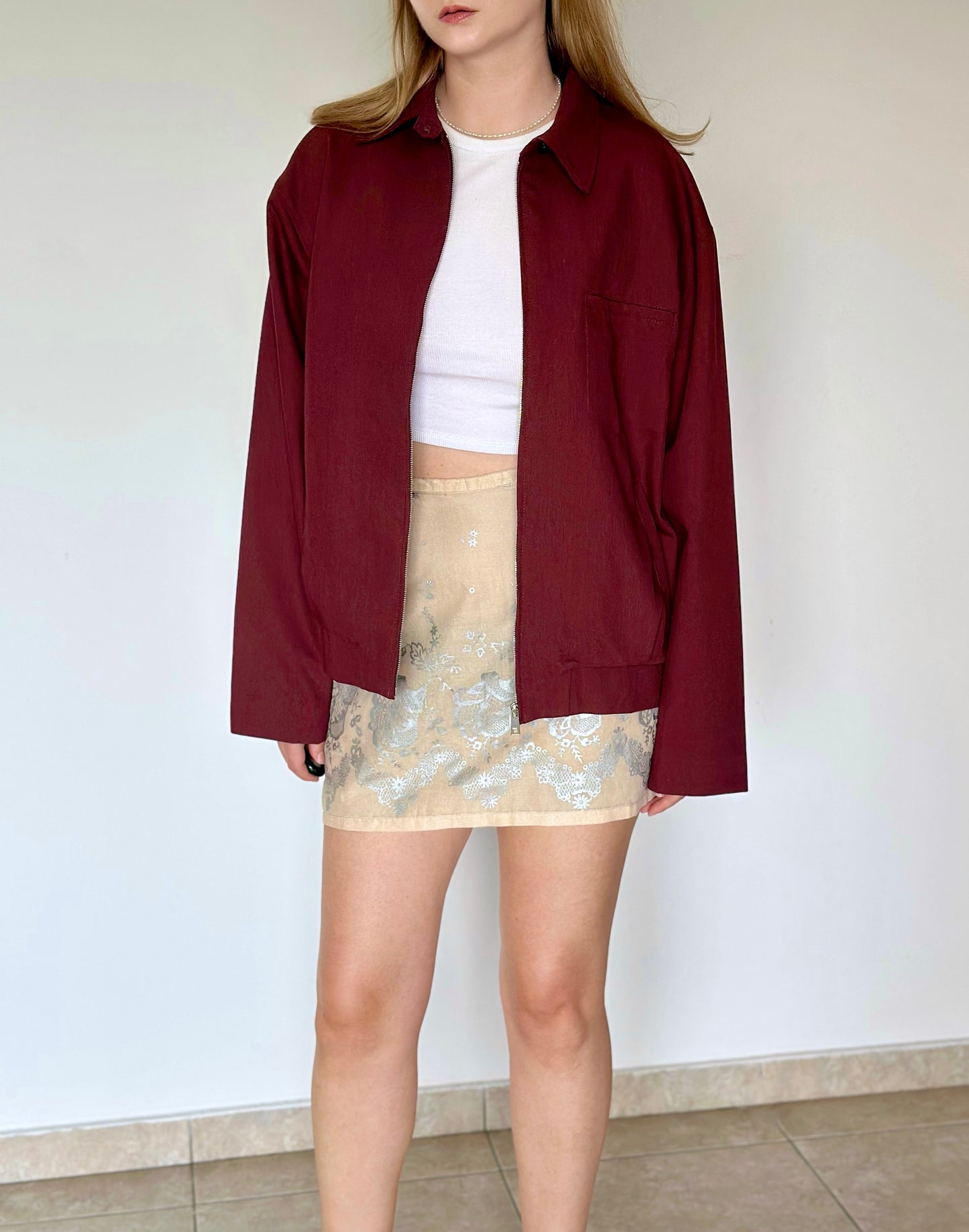 Soft beige cotton mini skirt with floral pattern