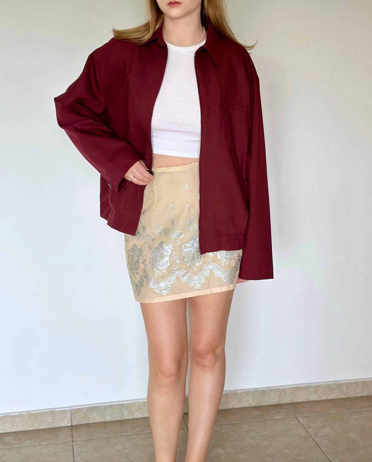 Soft beige cotton mini skirt with floral pattern