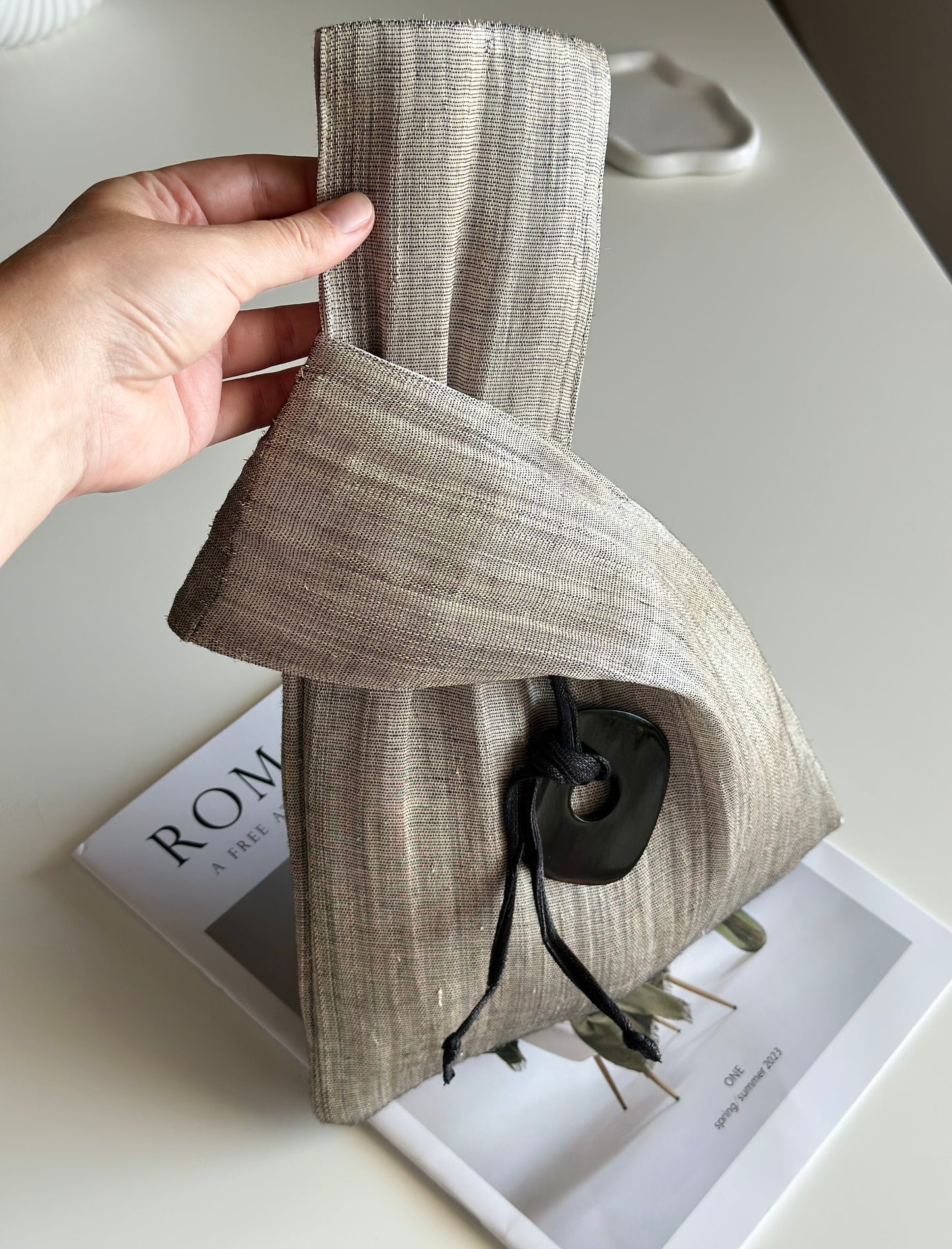 An elegant hand-held clutch