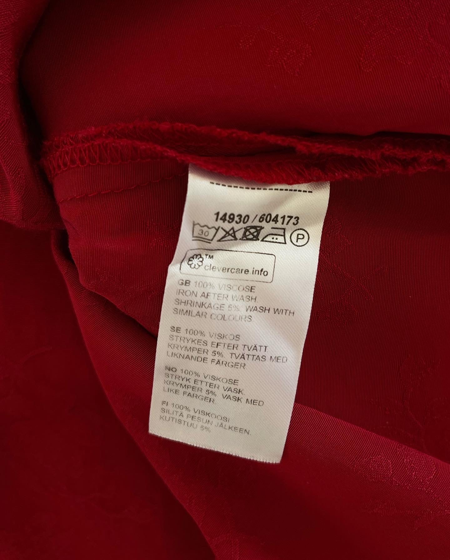 Beautiful feminine red dress made from viscose with jacquard pattern