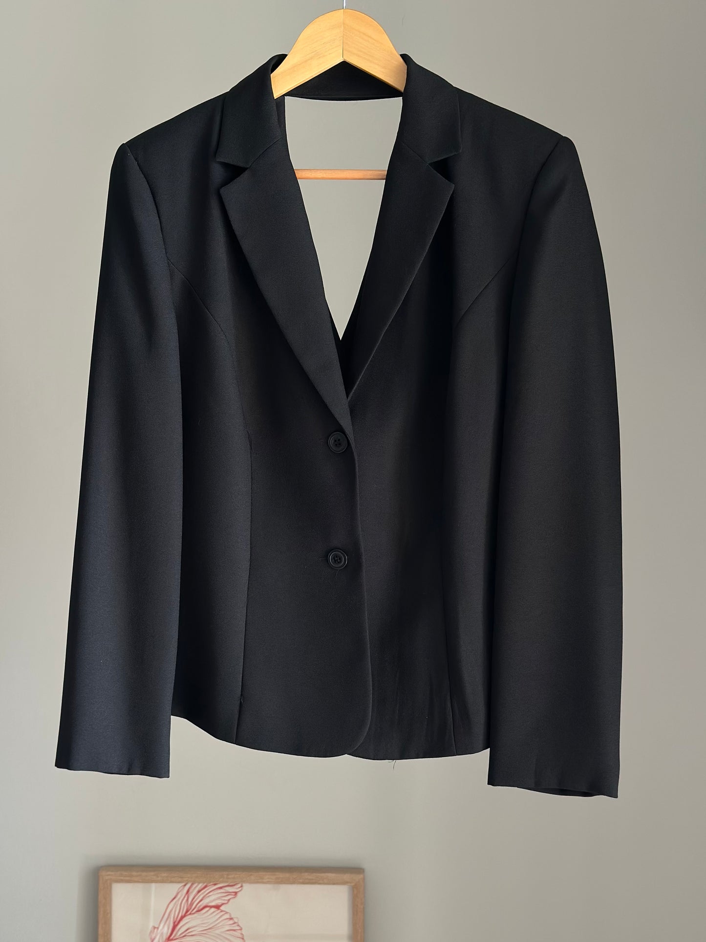 Striking vintage black blazer with open back