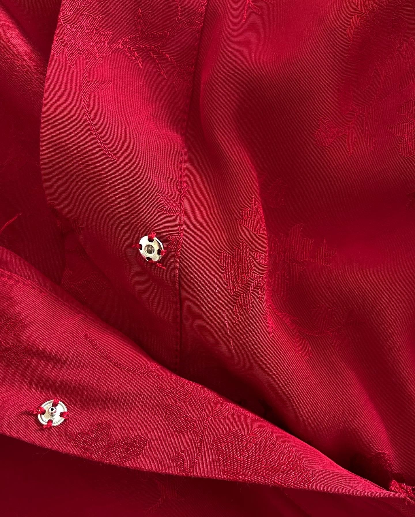 Beautiful feminine red dress made from viscose with jacquard pattern