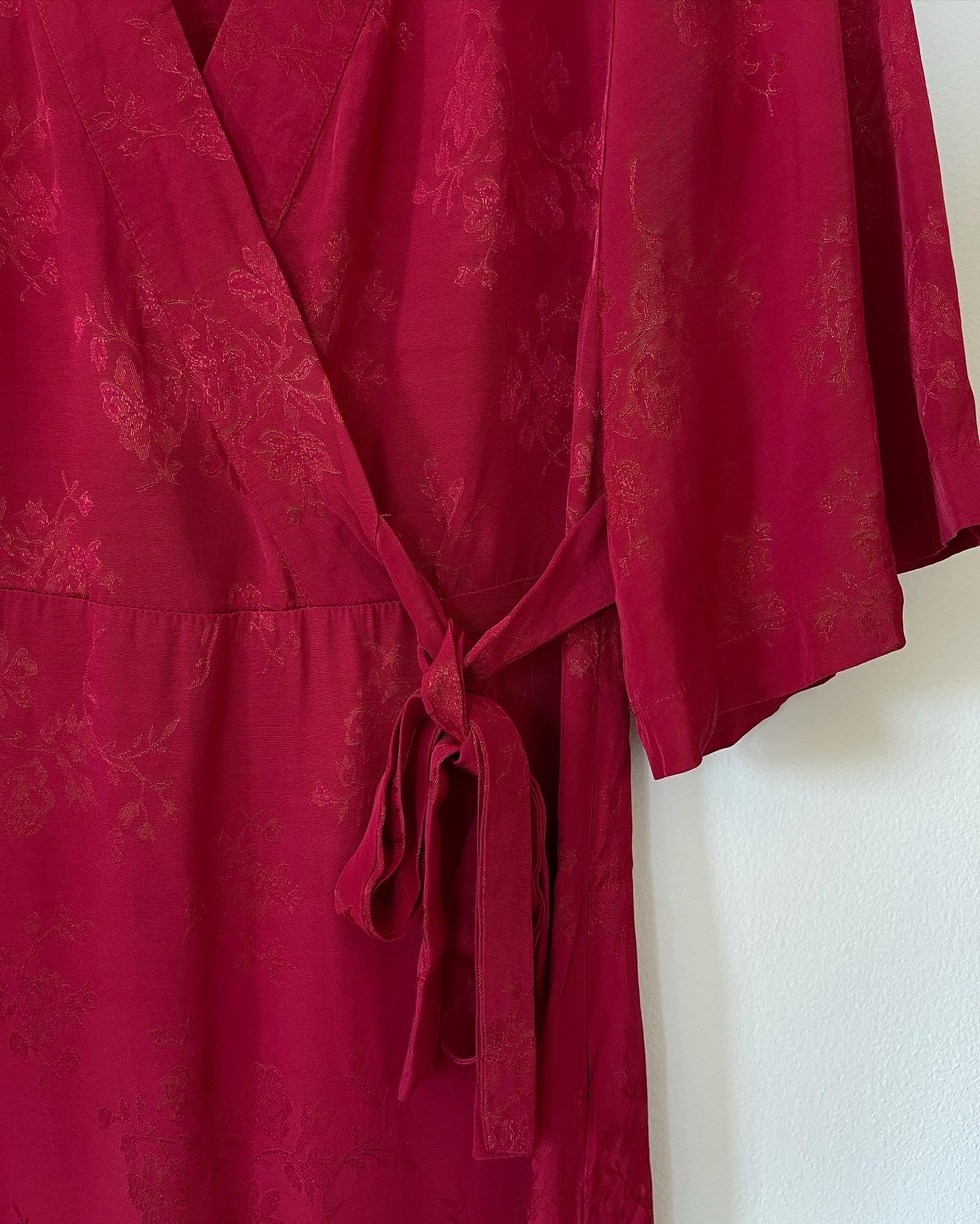 Beautiful feminine red dress made from viscose with jacquard pattern