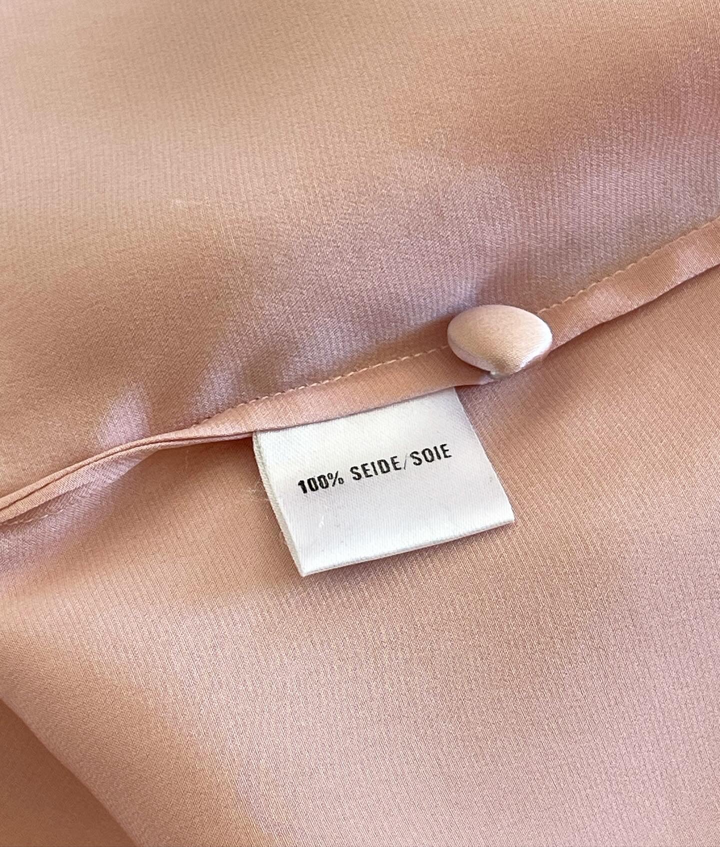 Elegant vintage pink blouse in pajama style