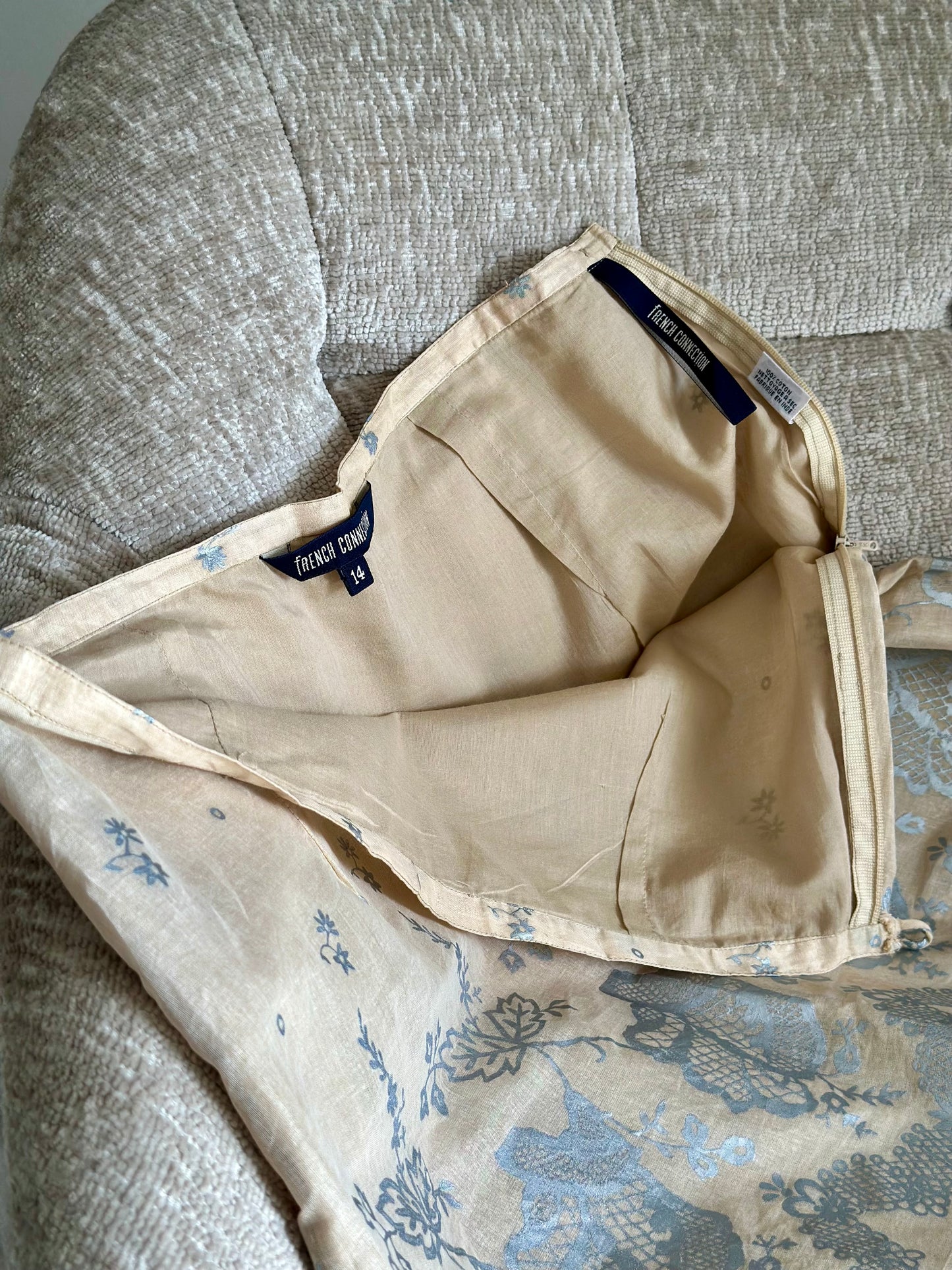 Soft beige cotton mini skirt with floral pattern
