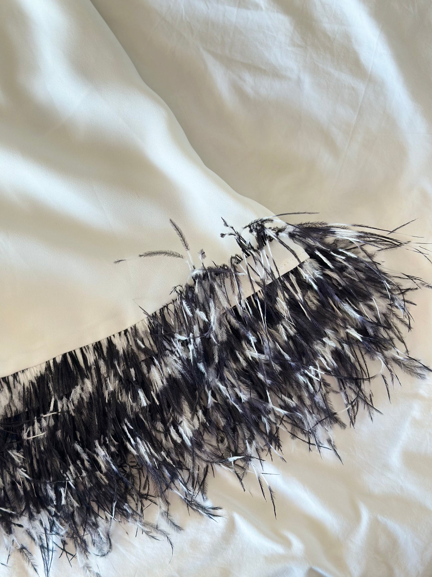 Lovely white tunic top with natural feathers