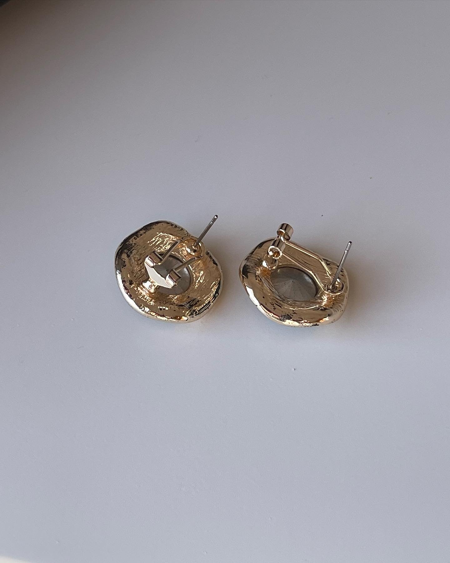 Vintage earrings decorated with green crystals and rhinestones