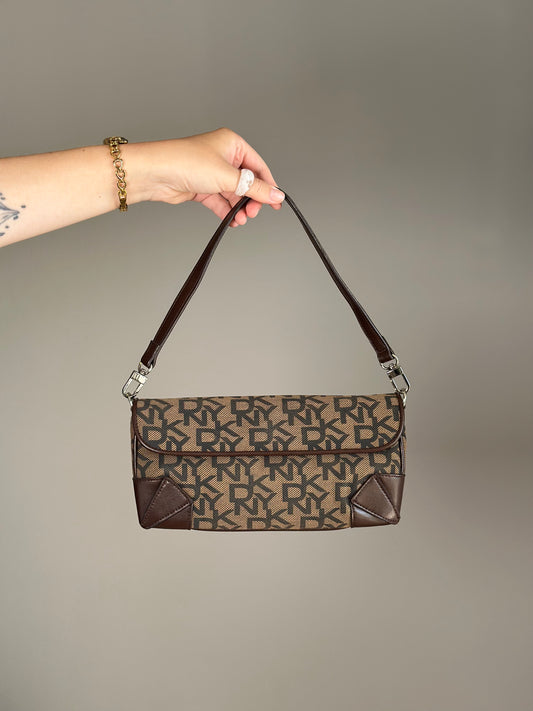 Chic vintage DKNY baguette bag with a rich brown monogram pattern