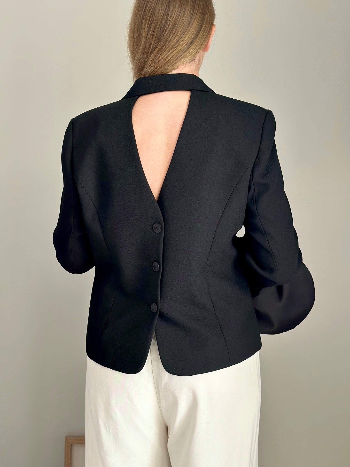 Striking vintage black blazer with open back