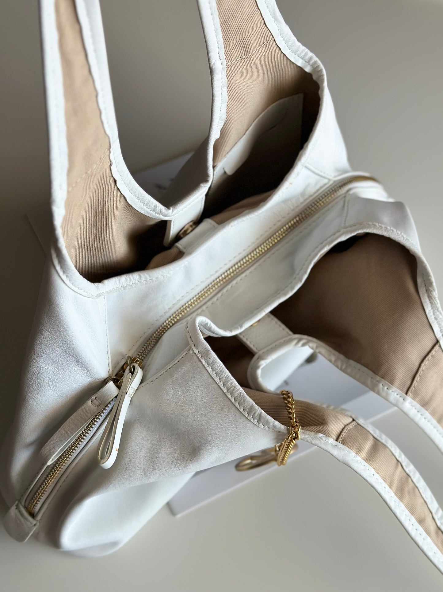 Stylish Coccinelle bag in soft white leather