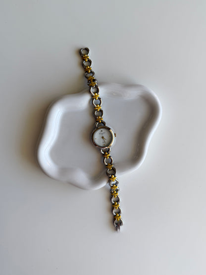 Vintage two-tone watch with a delicate round dial