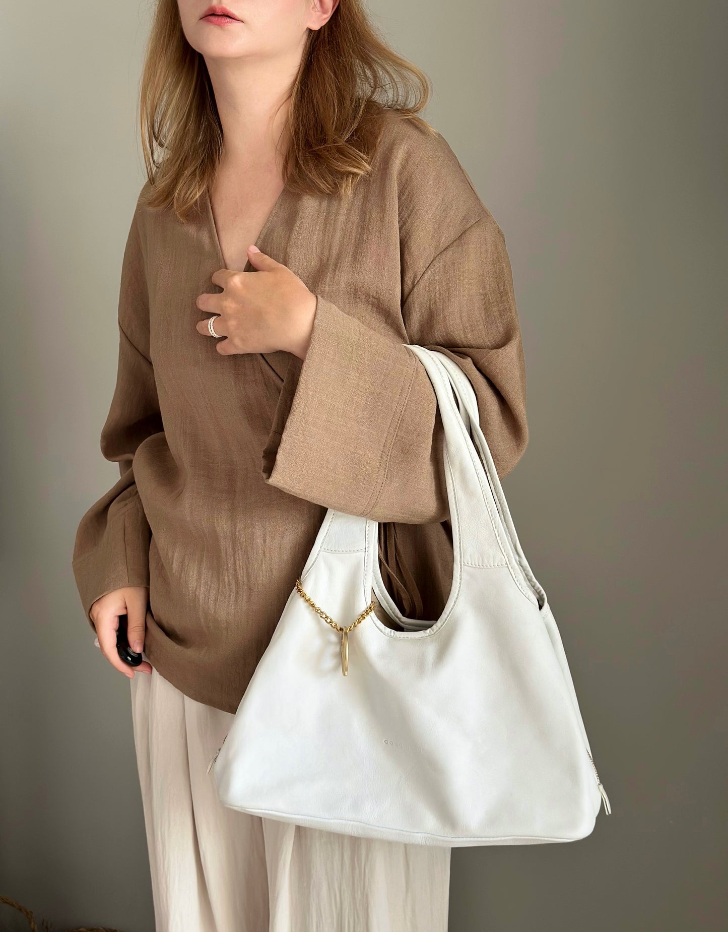 Stylish Coccinelle bag in soft white leather