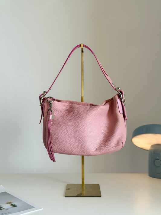 Lovely vintage Coach bag crafted from pink pebbled leather