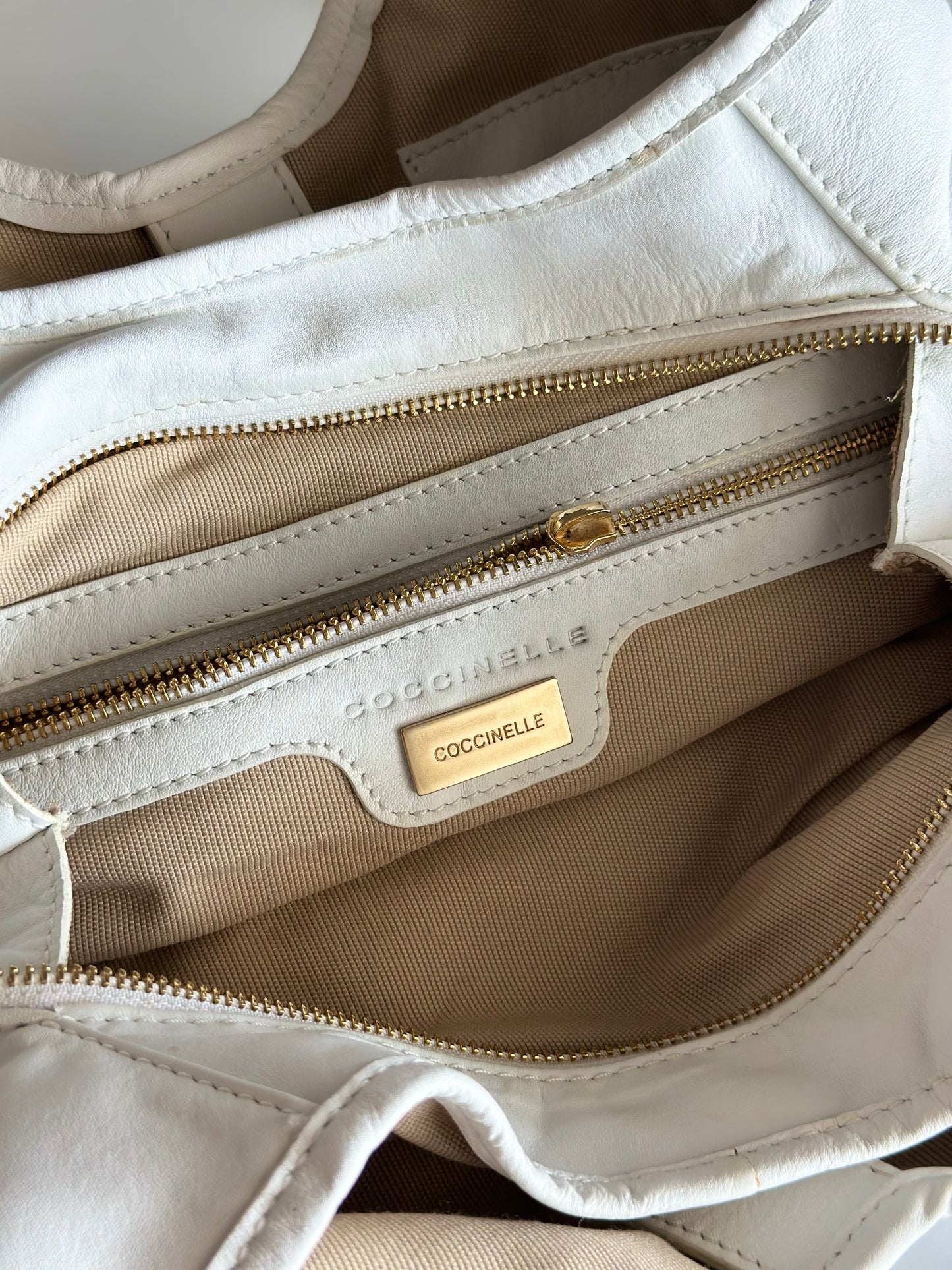 Stylish Coccinelle bag in soft white leather
