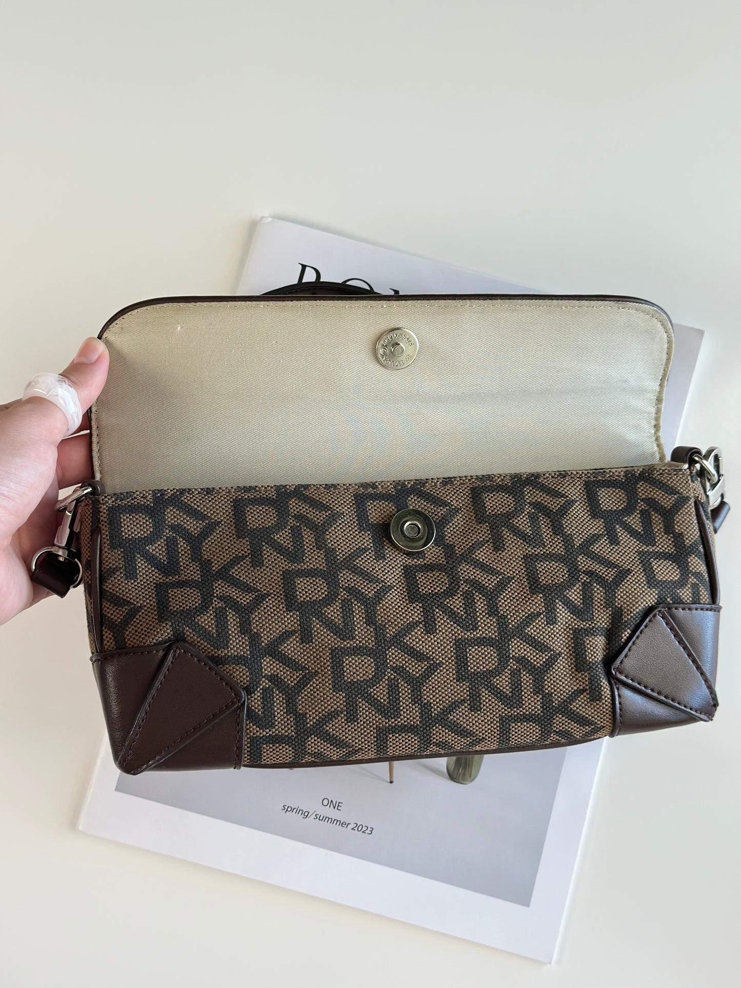 Chic vintage DKNY baguette bag with a rich brown monogram pattern