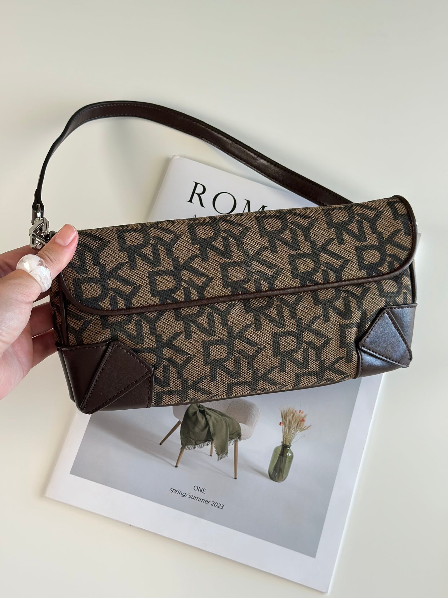 Chic vintage DKNY baguette bag with a rich brown monogram pattern