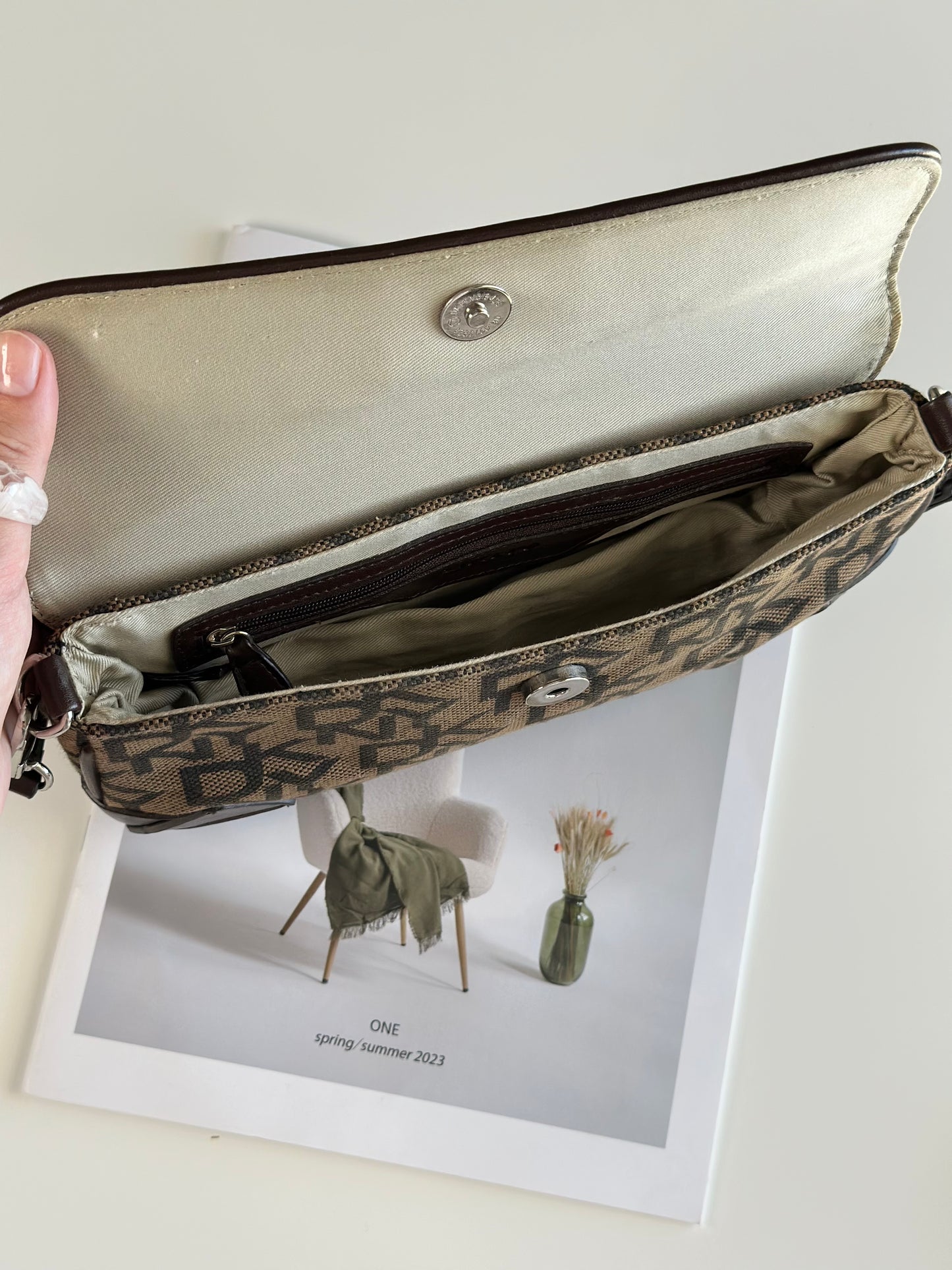 Chic vintage DKNY baguette bag with a rich brown monogram pattern