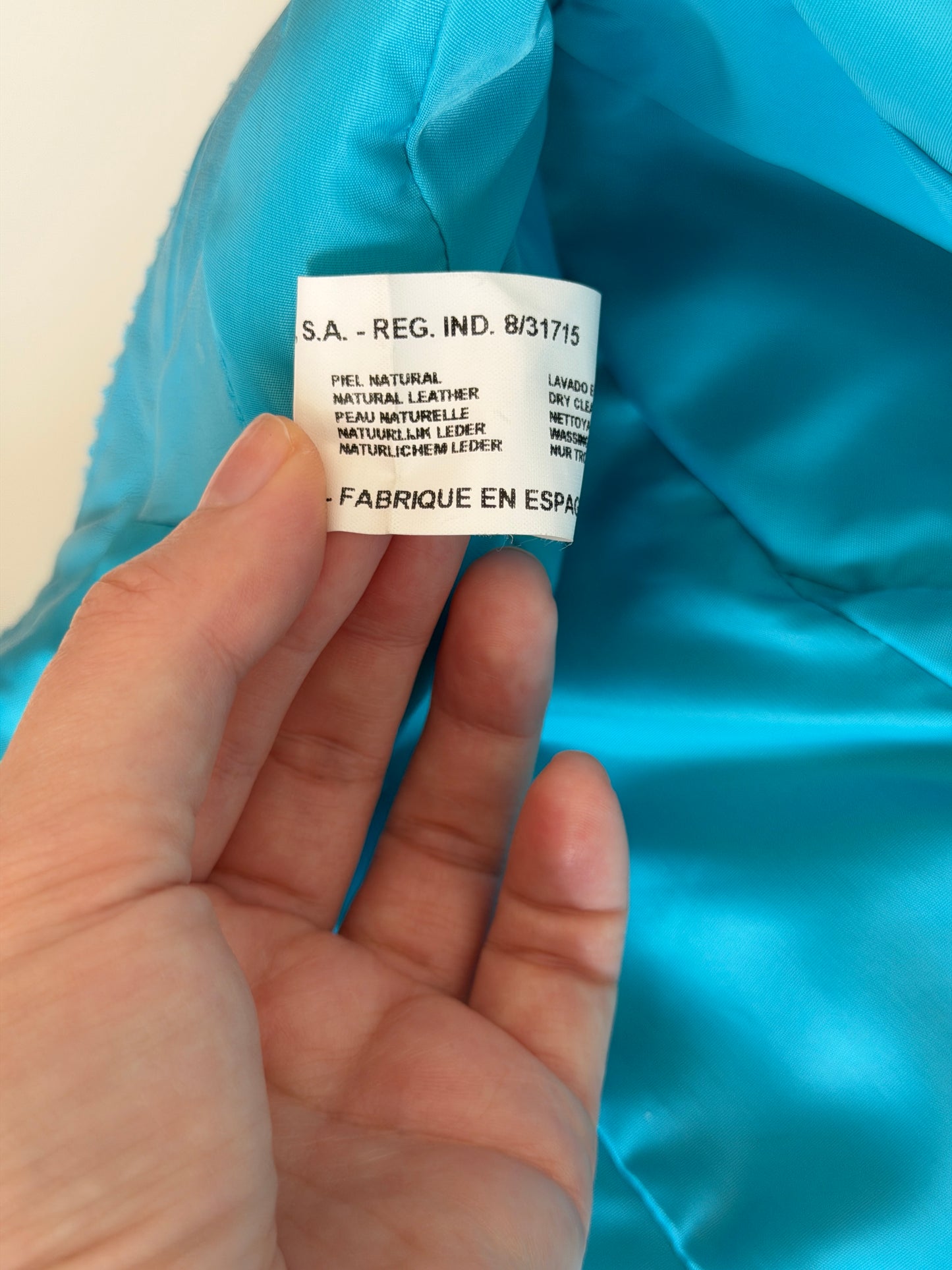 Vintage leather jacket in striking turquoise shade