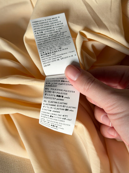 Stylish pale yellow long trench coat