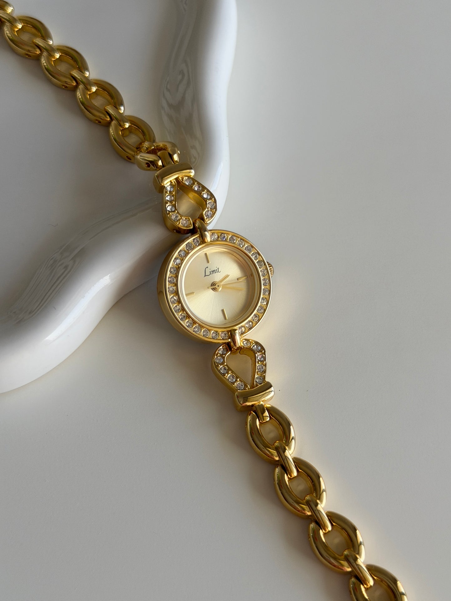 Amazing gold-tone watch Limit with rhinestones