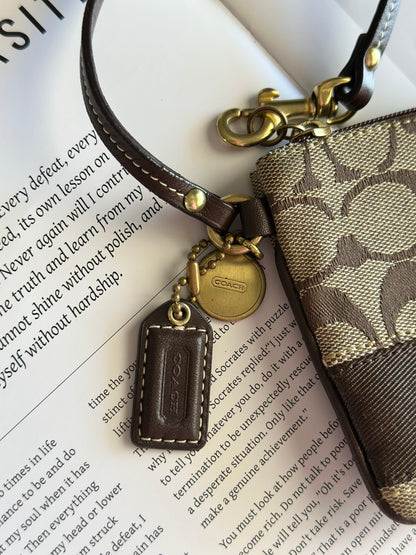 Iconic vintage brown Coach wristlet