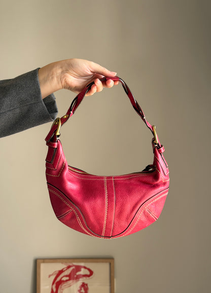 Iconic vintage Coach Soho bag in vibrant fuchsia leather