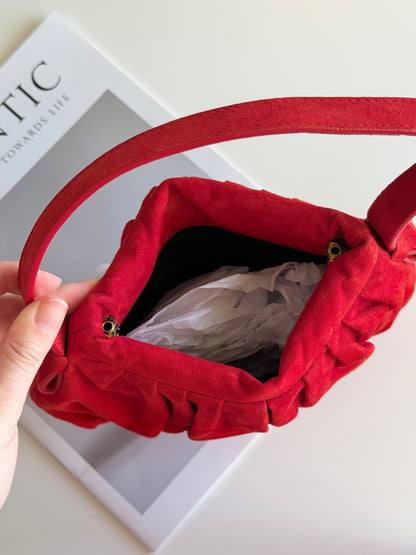 Vibrant red bag crafted from soft suede by Hobbs