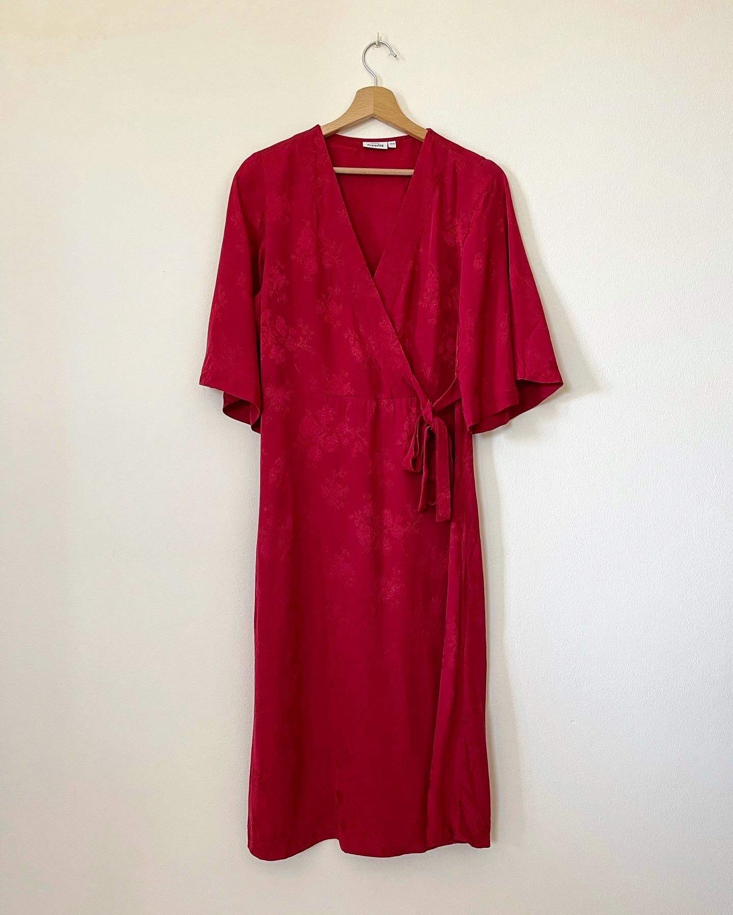 Beautiful feminine red dress made from viscose with jacquard pattern