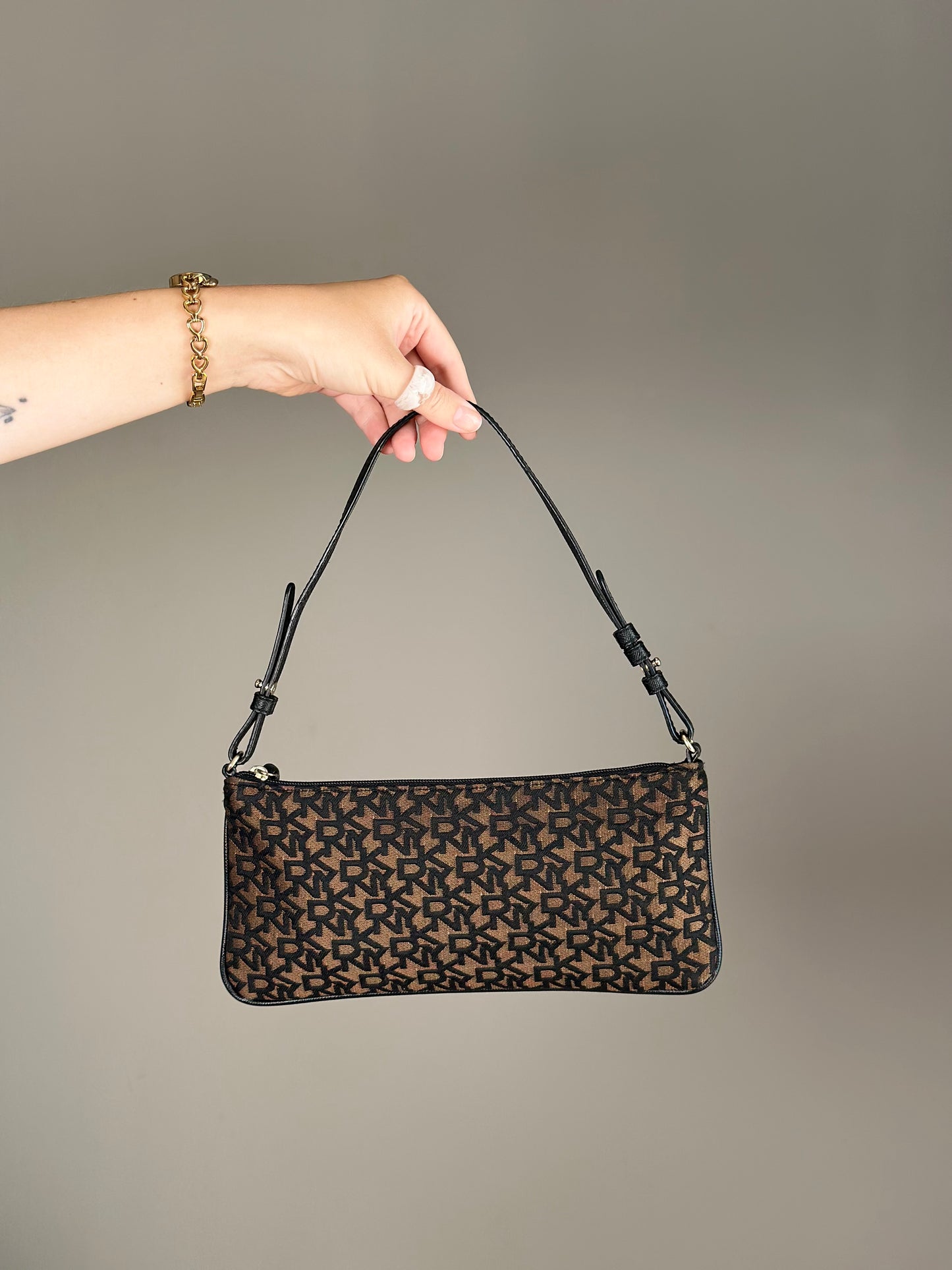 Stylish vintage DKNY baguette bag in bronze and black