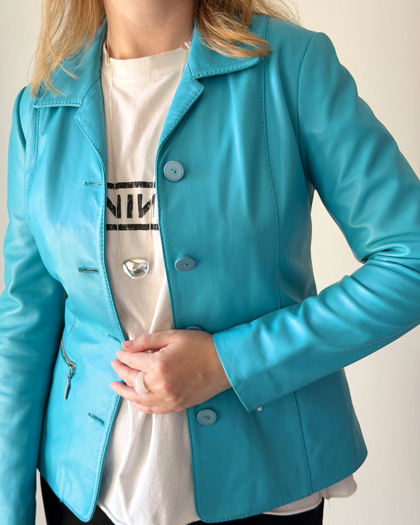 Vintage leather jacket in striking turquoise shade