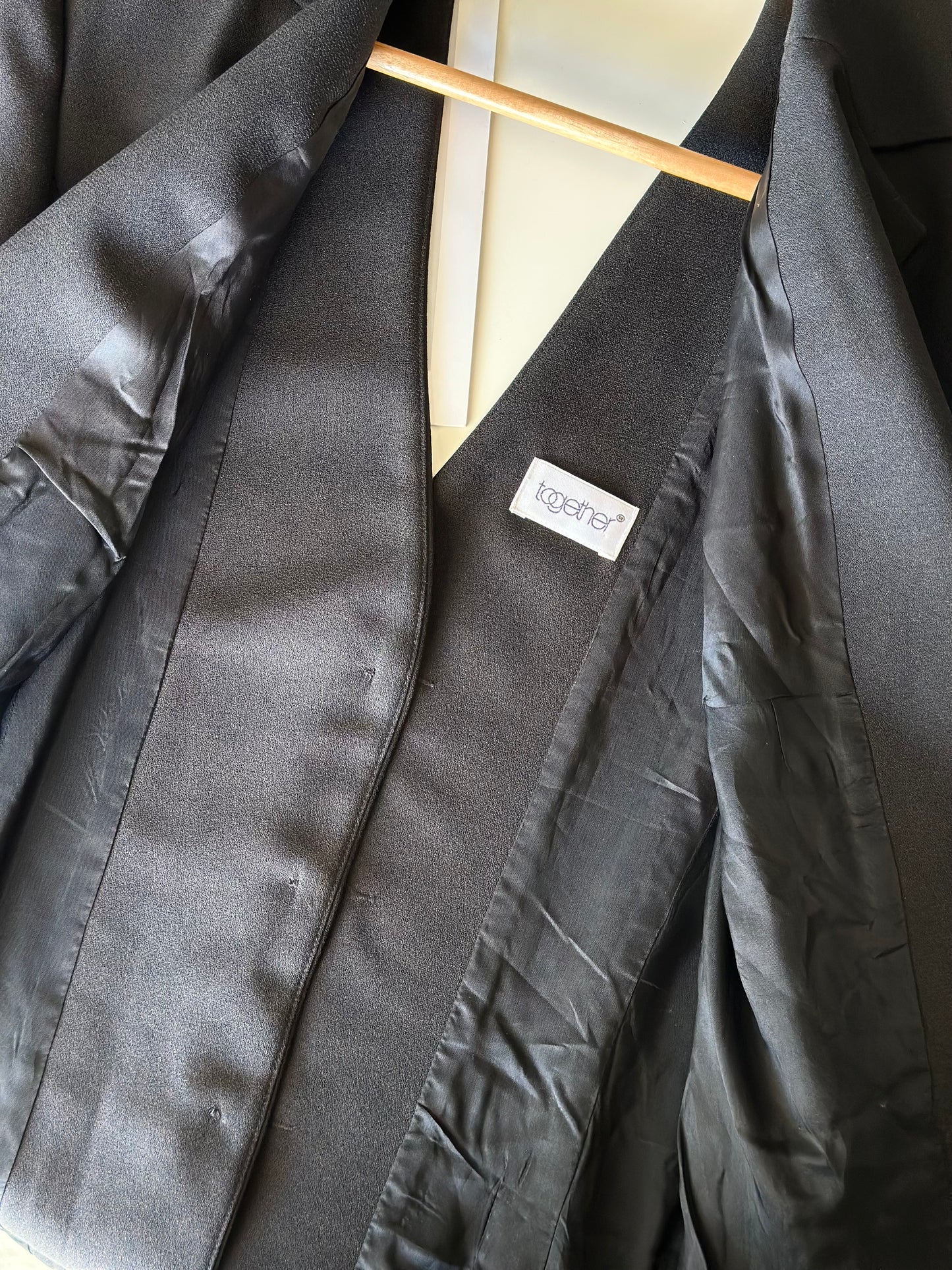 Striking vintage black blazer with open back