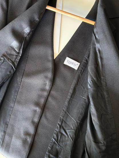Striking vintage black blazer with open back