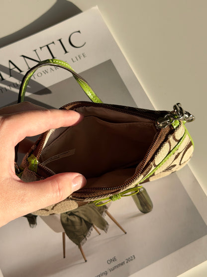 Vintage Coach wristlet with lime green bow