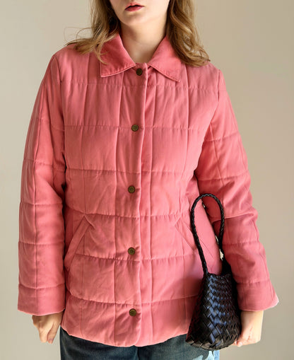 Charming quilted jacket in a soft coral pink shade