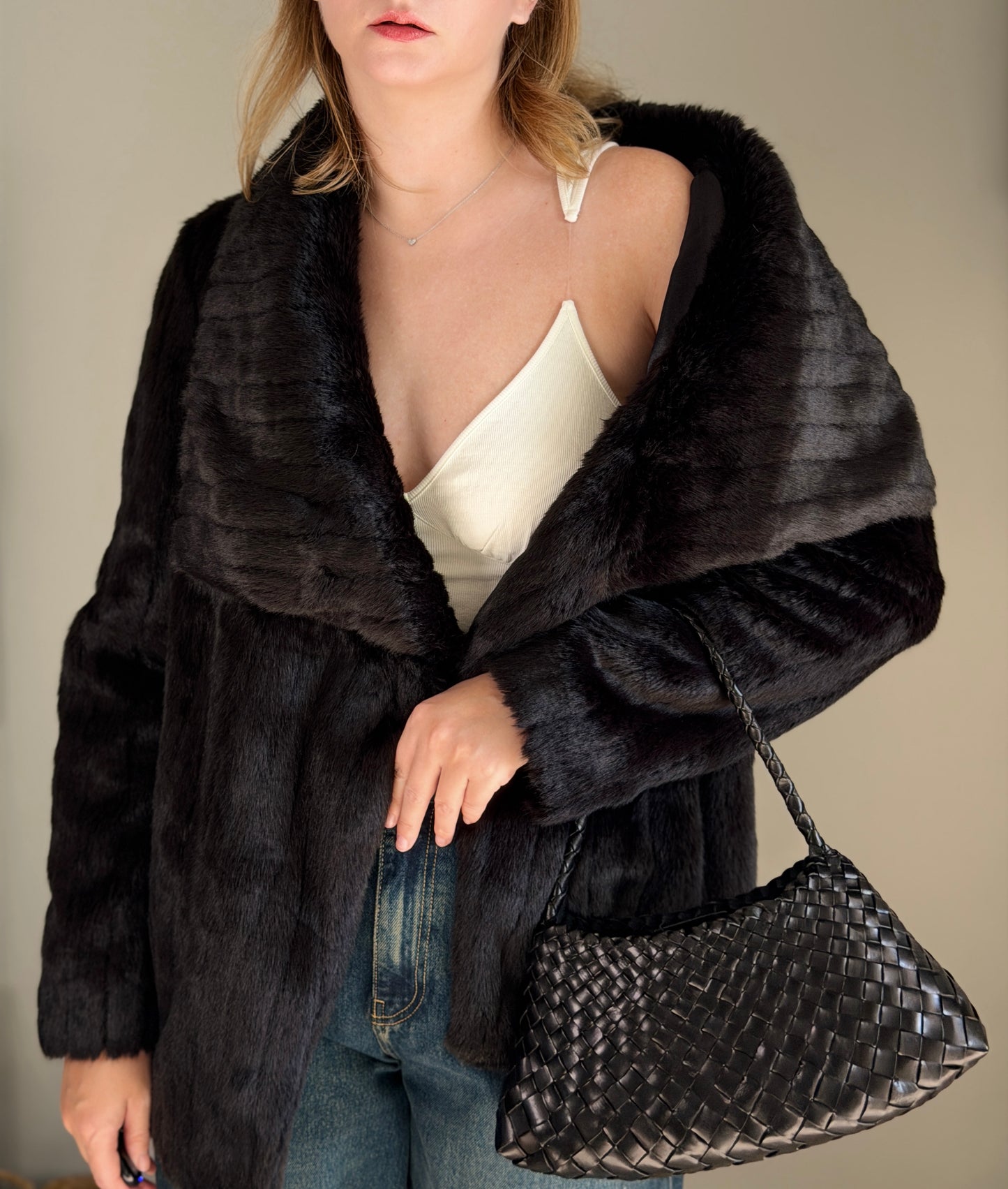 Stunning black faux fur coat with a dramatic look