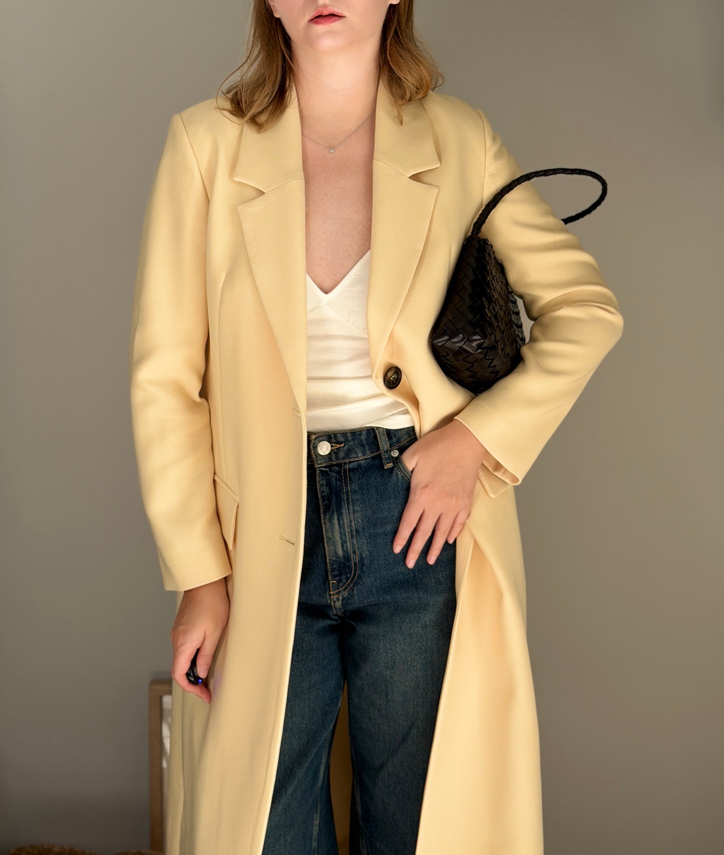 Stylish pale yellow long trench coat