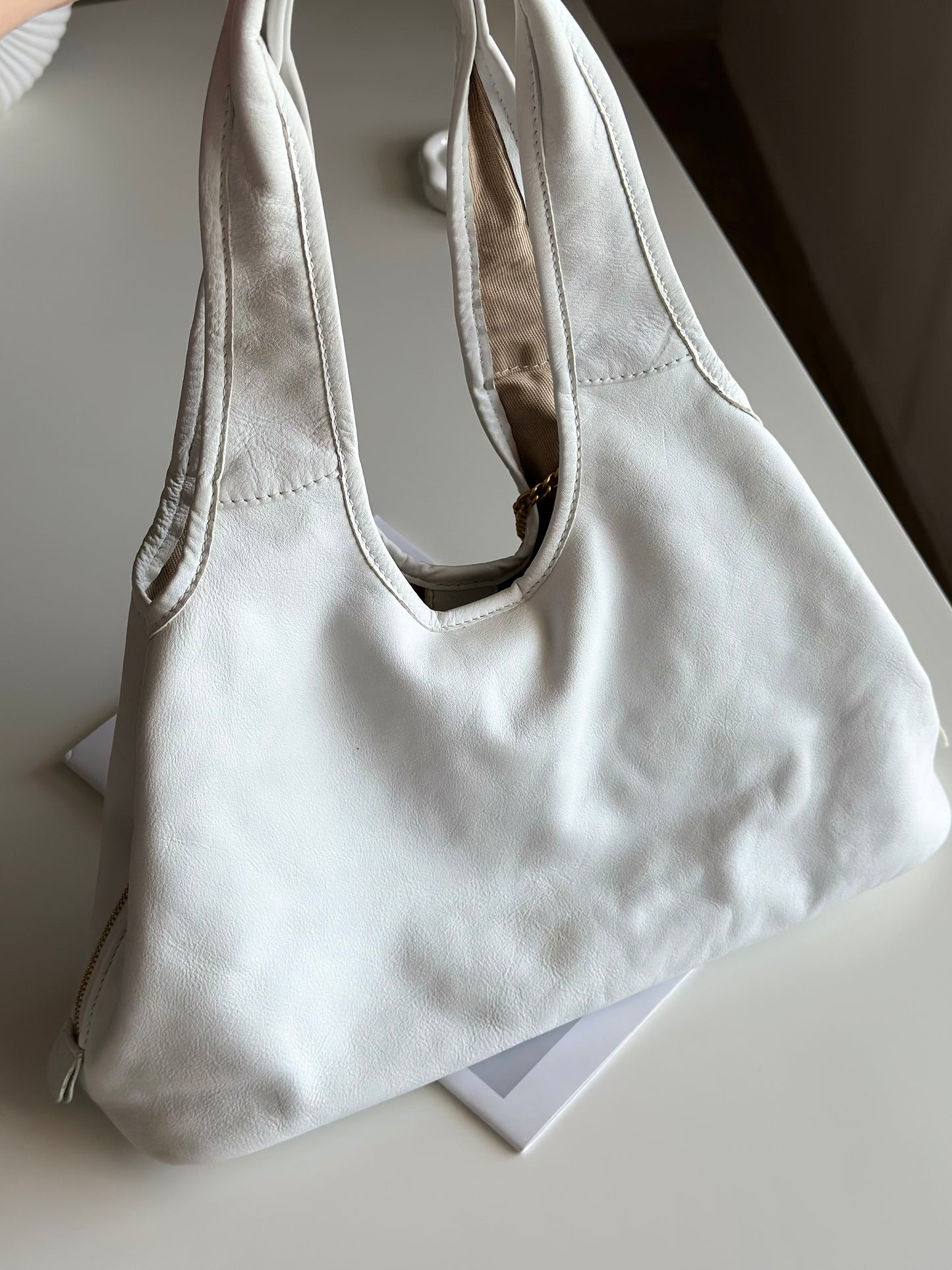 Stylish Coccinelle bag in soft white leather