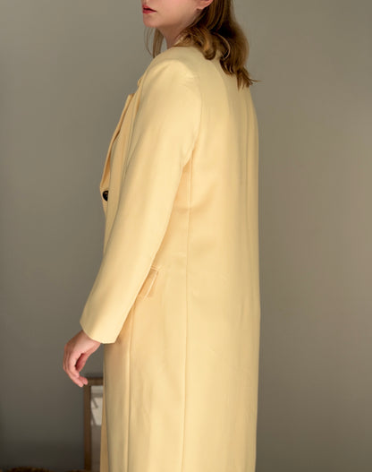 Stylish pale yellow long trench coat