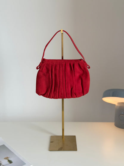 Vibrant red bag crafted from soft suede by Hobbs