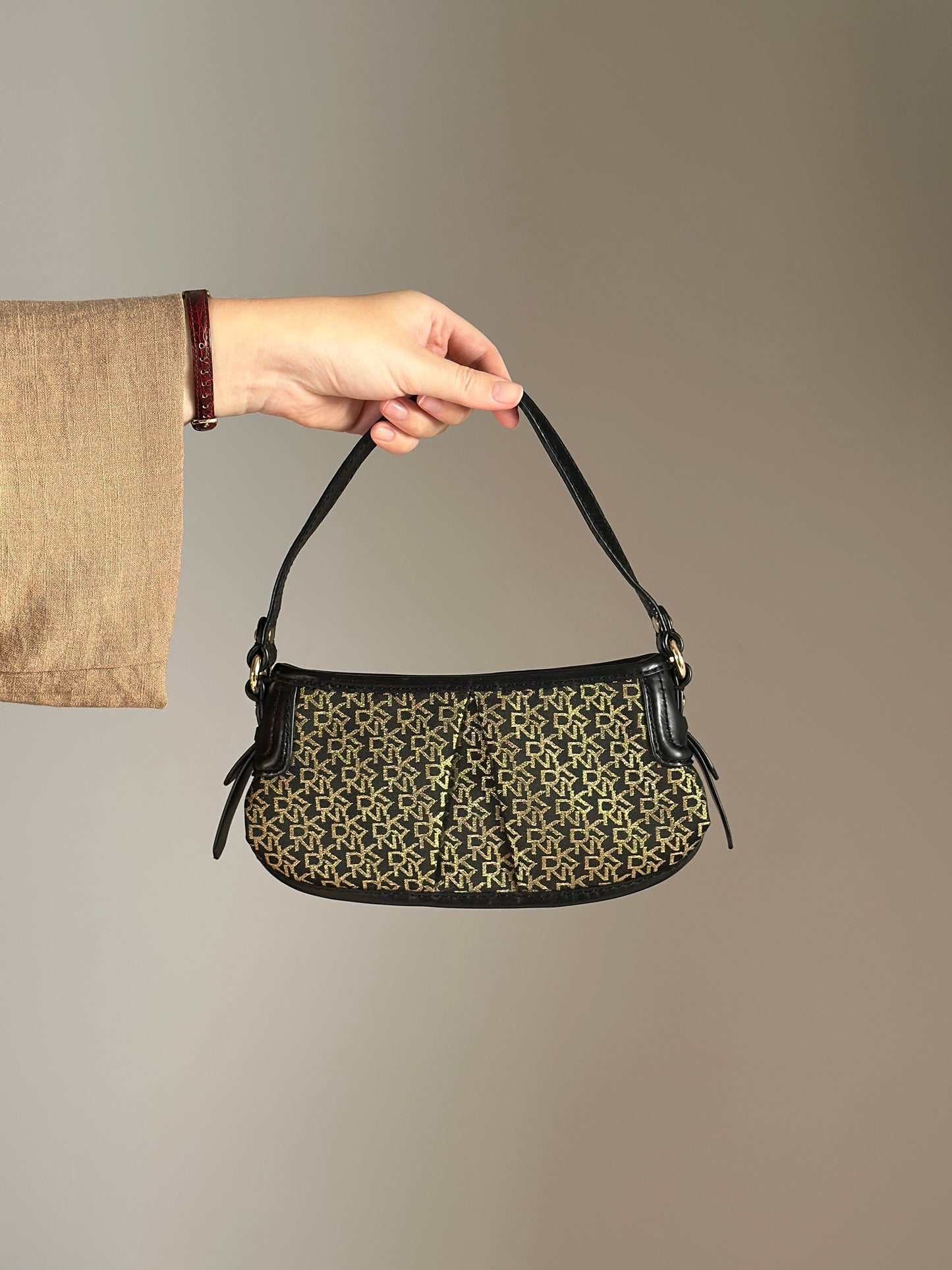 Chic vintage DKNY bag in black and gold